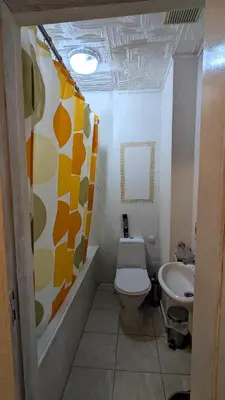 a bathroom with a toilet and a sink at Apartments Iris69 in Varna City