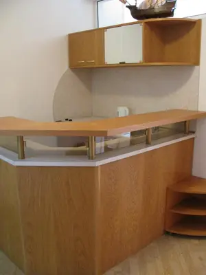 a desk in a room with wooden cabinets at Apartments Iris69 in Varna City