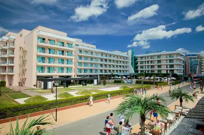 a group of people walking in front of a building at DIT Evrika Beach Club Hotel - All Inclusive in Sunny Beach