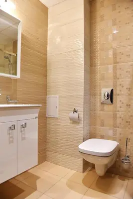 a bathroom with a toilet and a sink at Apartments Lucky Complex Ravda in Ravda