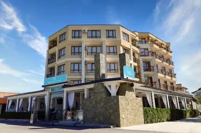 a tall white building with a sign on it at Lozenets View Hotel in Lozenets