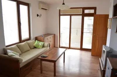 a living room with a couch and a coffee table at ART Apartments - Pomorie in Pomorie