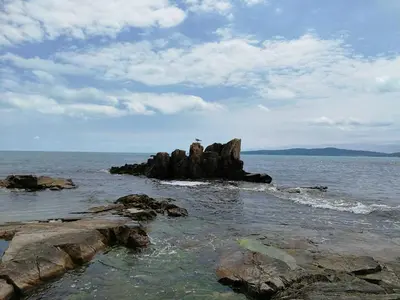 a lighthouse on a rock in the middle of the ocean at Luxury House on Buzhaka in Sozopol