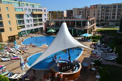 an overhead view of a pool with a white tent at Pollo Resort in Sunny Beach