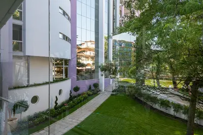 an internal courtyard of a building with a lawn at Hotel Neptun Beach in Sunny Beach