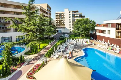 an overhead view of a hotel pool with chairs and an umbrella at Hotel Laguna Park & Aqua Club - All Inclusive in Sunny Beach