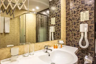 a bathroom with a sink and a mirror at Hotel Laguna Park & Aqua Club - All Inclusive in Sunny Beach