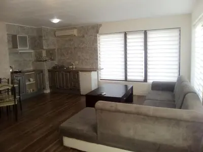 a living room with a couch and a table at Apartments Stefanov in Byala in Byala