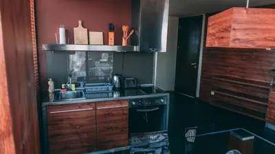 a kitchen with a sink and a stove at Design Hotel Logatero in Sozopol