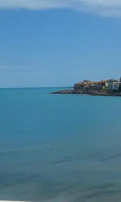 a large body of water with houses in the background at Agalina Sea House in Sozopol