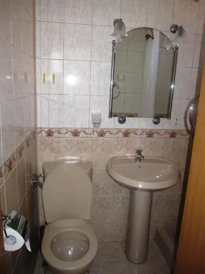 a bathroom with a toilet and a sink at Guesthouse Olimp in Sozopol