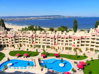 an aerial view of a resort with two pools at Апартаменти Варна Саут на плажа - Varna South Apartments on the beach in Varna City