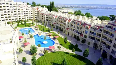 an aerial view of a large apartment complex with a swimming pool at Апартаменти Варна Саут на плажа - Varna South Apartments on the beach in Varna City
