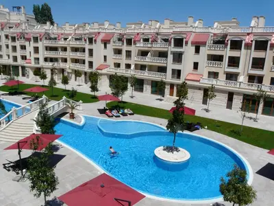 a large pool in front of a large building at Апартаменти Варна Саут на плажа - Varna South Apartments on the beach in Varna City