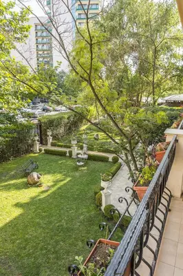 a view of a garden from a balcony at Family Hotel Gold Pearl in Sunny Beach