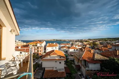 a view of a city from a balcony at Hotel Chuchulev in Sozopol