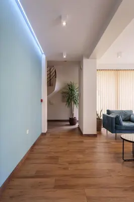 a living room with a couch and a table at Hotel Milan in Primorsko