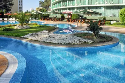 a swimming pool in a hotel with a resort at Hotel Caesars Palace in Sunny Beach