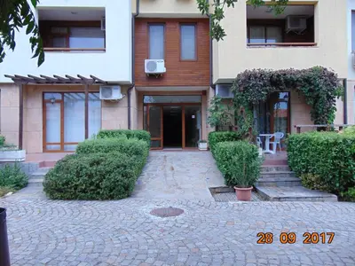 a house with a brick driveway in front of it at Болгария, г.Свети Влас, к.