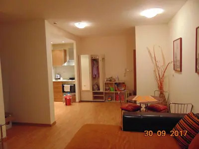 a living room with a couch and a table at Болгария, г.Свети Влас, к.