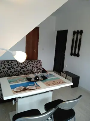 a living room with a table and a couch at penyrent in Varna City