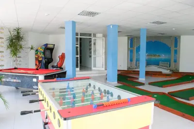 a room with a pool table and trampoline at Sineva Park Hotel - All Inclusive in Sveti Vlas