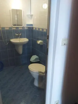 a bathroom with a toilet and a sink at Primorsko Apartments in Primorsko