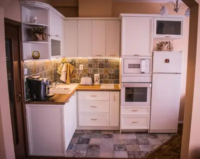 a white kitchen with white cabinets and appliances at Two Bedroom Apartment Downtown Ivanovi in Varna City