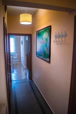 a hallway with a painting on a wall at Two Bedroom Apartment Downtown Ivanovi in Varna City