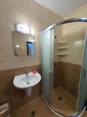 a bathroom with a shower and a sink and a shower at Flowers Studio in Pomorie