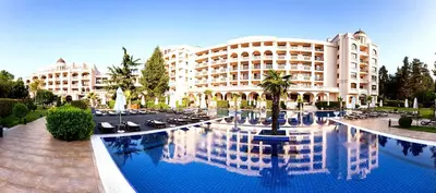 a hotel with a pool in front of a building at Primoretz Grand Hotel & Spa in Burgas City