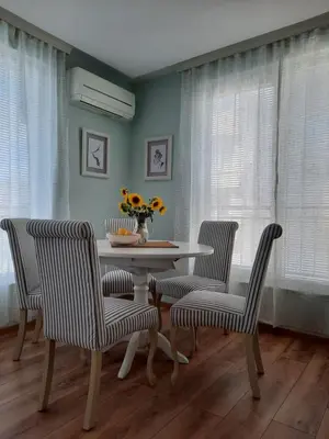 a dining room with a table and two chairs at Soulful Apartments - Horizon in Varna City