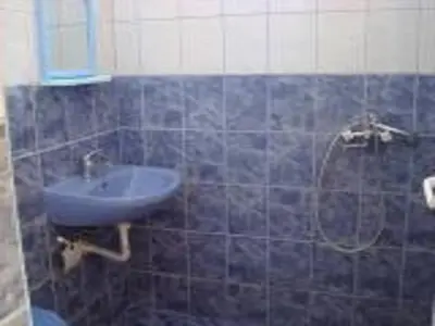 a bathroom with a sink and a shower at Morski Rai Rooms in Byala