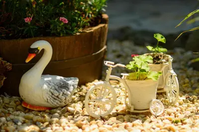 a toy swan and a bike with a potted plant at Villa Yanevi in Lozenets