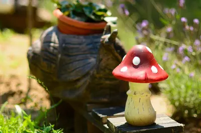a small red and white mushroom sitting next to a vase at Villa Yanevi in Lozenets