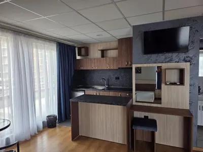 a kitchen with a sink and a counter top at Hotel City in Burgas City