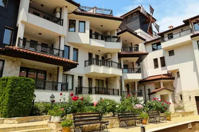 a building with benches in front of it at Complex Sozopol Dreams BMT in Sozopol