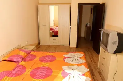 a bedroom with a bed with towels on it at Complex Sozopol Dreams BMT in Sozopol