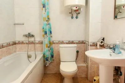 a bathroom with a toilet and a sink at Complex Sozopol Dreams BMT in Sozopol