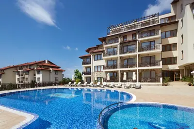 a large swimming pool in front of a building at Relax Holiday Complex & Spa in Sunny Beach