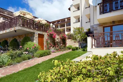 a garden in front of a building at Relax Holiday Complex & Spa in Sunny Beach