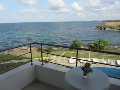 a balcony with a view of the ocean at Aparthotel Romance in Kiten