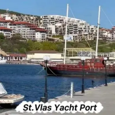 a boat docked at a dock in a body of water at Tanja in Sveti Vlas