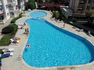 an overhead view of a large blue swimming pool at Bravo 5 Sunny Beach in Sunny Beach