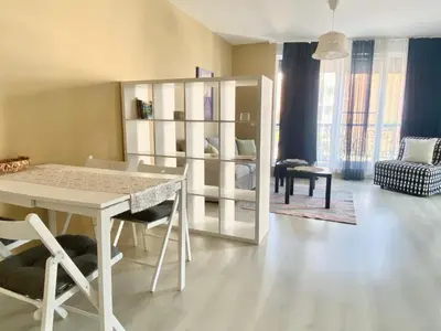 a living room with a white table and chairs at Apartments in Complex Sunny Island Deluxe in Chernomorets
