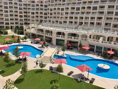 an aerial view of a hotel with a large pool at PSB Apartments in South Bay Varna in Varna City