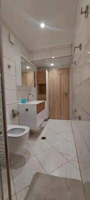 a bathroom with a toilet and a sink at Black Sea View - Luxory apartment by the sea in Burgas City