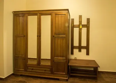 a wooden cabinet with a bench in a room at к-г Луна к-с Лонгоза комплекс Лонгоза in Byala