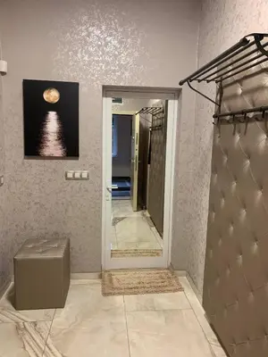 a bathroom with a mirror and a picture of the ocean at De Luxe Studio Burgas, City Center in Burgas City