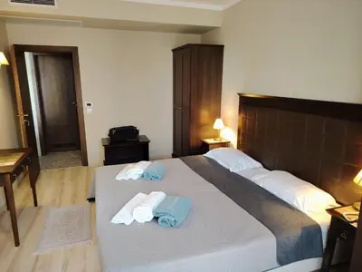 a bedroom with a large bed with towels on it at Apartment in Hotel Royal Beach 5 Pool View in Sunny Beach